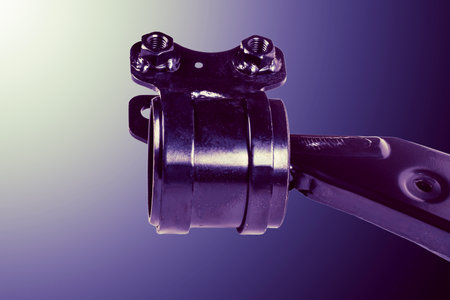 Close-up view of a car suspension component, illustrating detailed engineering and metallurgy.の写真素材