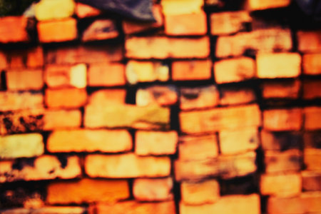 Stacked clay bricks showcasing a rustic texture and earthy colors at a construction site in a sunny...