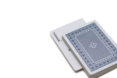 Playing cards laying on a white background