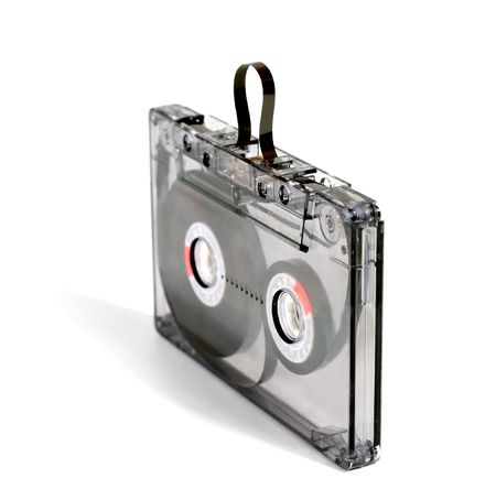 Black, transparent audiocassette on a white backgroundの写真素材