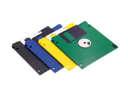 The hand holds some multi-coloured diskettes on a white background