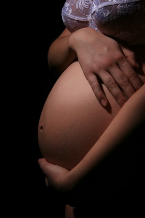Stomach of the pregnant woman close upの写真素材