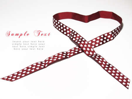 Red ribbon with heart shape2の写真素材