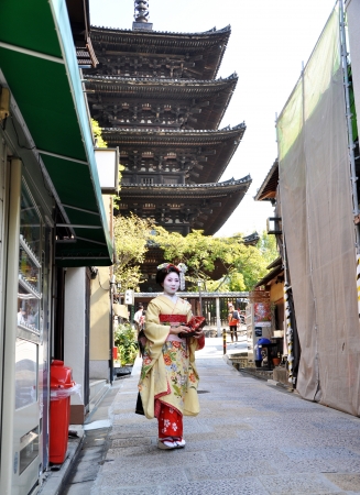 KYOTO, JAPAN - OCT 21 2012: Japanese ladies in traditional dress  on a street leading to Kiyomizu Temple on October 21 2012. Kiyomizu is a famous temple in Kyoto built in year 778.のeditorial素材