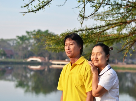 Happy couple at beautiful park outdoor in nature の写真素材