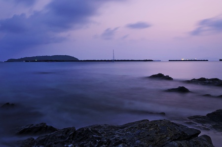 Sunset at Si Chang Island. Evening by the sea. The sand and rock beach, thailand