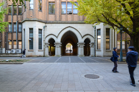Tokyo - November 22: Undentified student around arched doors in Tokyo University, Japan on November 22, 2013 , Japan のeditorial素材
