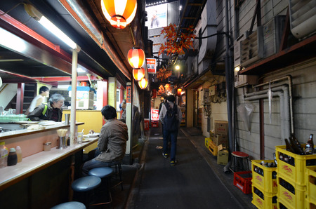TOKYO,JAPAN - NOVEMBER 23  Narrow pedestrian street known as Yakatori alley Omoide Yokocho  in the old Shinjuku district in Tokyo, Japan on the night of November 23, 2013  A few traditional restaurants are located here のeditorial素材