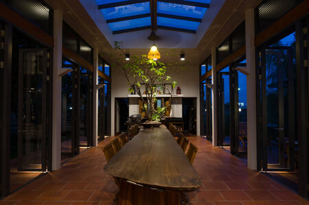 Wooden table and chairs in tropical style dining roomのeditorial素材