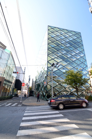 Tokyo, Japan - November 24,2013  Person walks by Prada store on November 24, 2013 in Omotesando,...