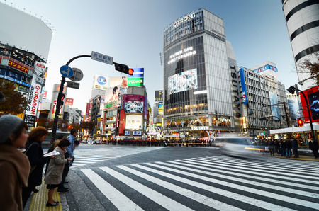Tokyo, Japan - November 28, 2013: Crowds of people crossing the center of Shibuya district on November 28 2013, Shibuya is the most important commercial center in Tokyo, Japanのeditorial素材