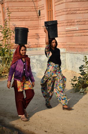 Jodhpur, India - January 1, 2015: Indian women going for the water in well of village, Jodhpur, Rajasthan, India. Jodhpur is the second largest city in the Indian state of Rajasthan with over 1 million habitants.のeditorial素材