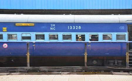 Jaipur, India - January 3, 2015: passengers at the window of a Indian Railway train at the railway station of Jaipur, Rajasthan, India. Indian Railways carries about 7,500 million passengers annually.のeditorial素材