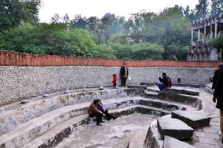 Chandigarh, India - January 4, 2015: People visit Rock statues at the rock garden on January 4, 2015 in Chandigarh, India. The rock garden was founded by artist Nek Chand in 1957 and is made completely of recycled waste.のeditorial素材
