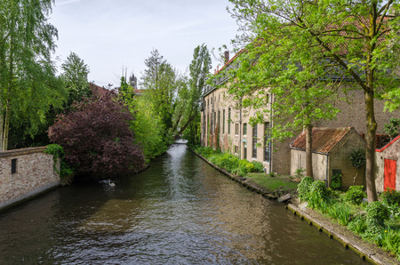 Canal in Bruges cityscape of Flanders Belgiumの写真素材