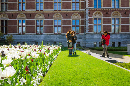 Amsterdam, Netherlands - May 6, 2015: Tourists at the garden around the Rijksmuseum, The Rijksmuseum is a Netherlands national museum dedicated to arts and history in Amsterdam.のeditorial素材