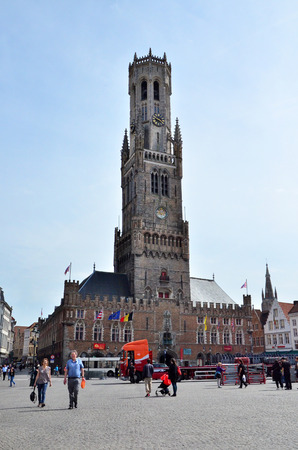 Bruges, Belgium - May 11, 2015: Tourist visit Belfry of Bruges on Grote Markt square on May 11, 2015. The historic city centre is a prominent World Heritage Site of UNESCO.のeditorial素材