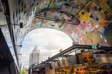 Rotterdam, Netherlands - May 9, 2015: Retail Shop in Markthal (Market hall) a new icon in Rotterdam. The covered food market and housing development shaped like a giant arch by Dutch architects MVRDV.のeditorial素材