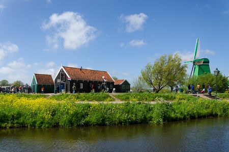 Zaanse Schans, Netherlands - May 5, 2015: Tourist visit Windmills and rural houses in Zaanse Schans, Netherlands. This village is a popular touristic destination in Netherlandsのeditorial素材