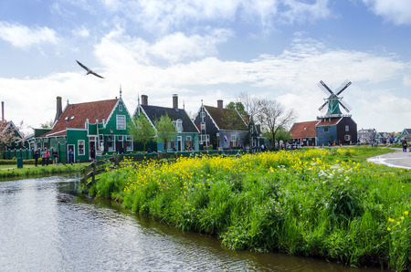 Zaanse Schans, Netherlands - May 5, 2015: Tourist visit Windmills and rural houses in Zaanse Schans, Netherlands. This village is a popular touristic destination in Netherlandsのeditorial素材