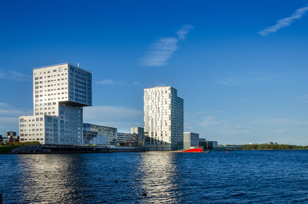 Almere, Netherlands - May 5, 2015: Skyline apartment buildings of Almere Stad, Netherlands - Silverline, The wave and Almere Towers at Weer Waterのeditorial素材