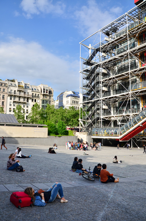 Paris, France - May 14, 2015: People relaxing at plaza in front of  Centre of Georges Pompidou on May 14, 2015 in Paris, France. The Centre of Georges Pompidou is one of the most famous museums of the modern art in the world.のeditorial素材