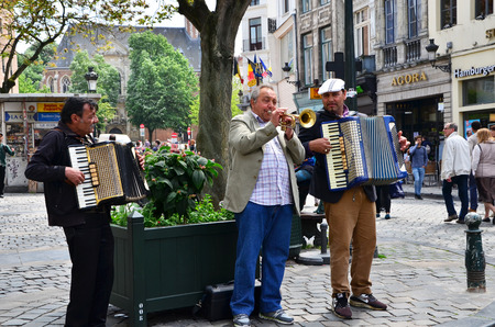 Brussels, Belgium - May 12, 2015: Street musician at Place d'Espagne (Spanish Sqaure) in Brussels,...