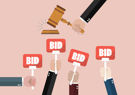 Auction and bidding concept. Hand holding auction paddle