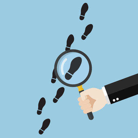 Hand holding magnifying glass over footsteps. Vector illustrationのイラスト素材
