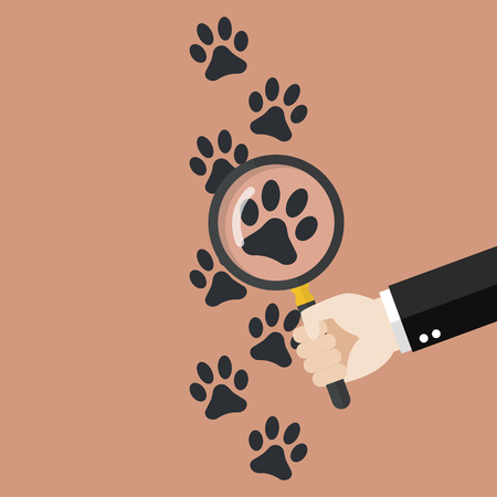 Hand holding magnifying glass over paw print. Vector illustrationのイラスト素材