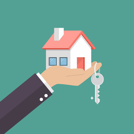 Hand holding home in palm and key on finger. Vector illustrationのイラスト素材