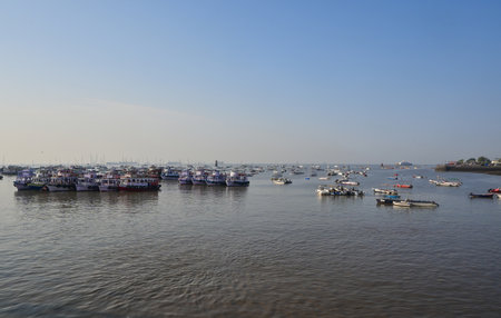 Arabian sea with colorful excursion ferry boats. Mumbai, Indiaの写真素材