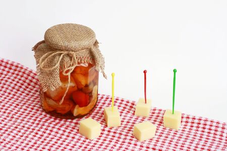 Pickled cheese in olive oilの写真素材