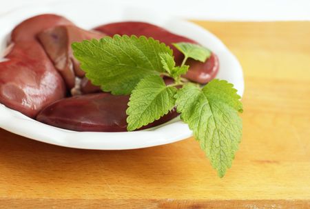 Plate of pork kidneys decorated  with lemon balmの写真素材