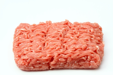Raw minced pork meat on white backgroundの写真素材