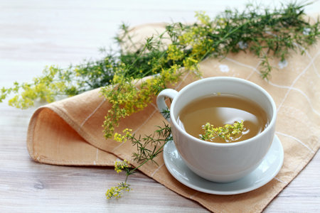 Herbal tea from herb Galium verum, also known as  lady's bedstraw or yellow bedstraw. Traditional medicinal herb for internal and external use, reduces appetite, helps to lose weight.の写真素材