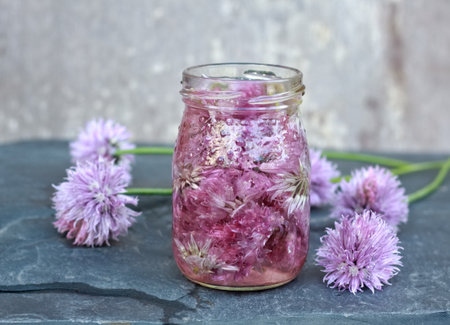 Seasoned vinegar with chive flower heads.
Herb infused in vinegar can be used to flavour salads and...