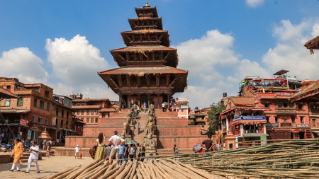 Tourists admiring Nyatapola Temple of Taumadhi Square.のeditorial素材