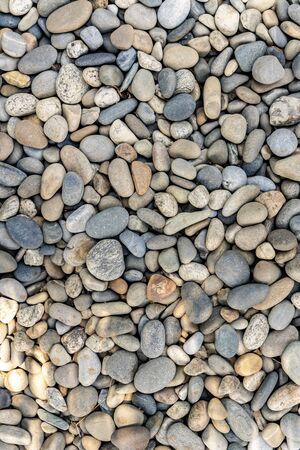 Small stones or pebbles background or textureの写真素材