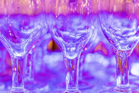 Wine glasses at a party background or textureの写真素材