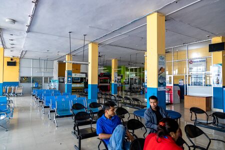 People waiting at airport terminalのeditorial素材