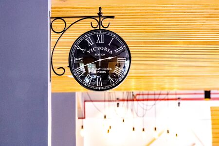 Vintage clock hanging by a wallのeditorial素材