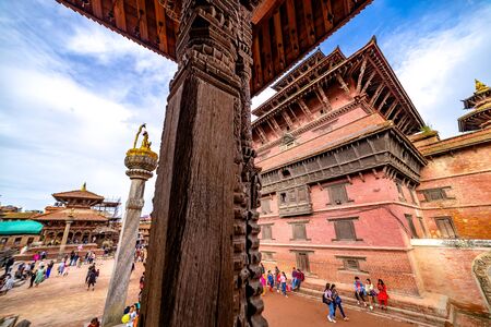 Kathmandu, Nepal - September 21 2019: People walking around Patan Durbar Square, a UNESCO Heritage site in Nepal. Temples reconstruction after Earthquake.のeditorial素材