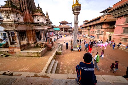 Kathmandu, Nepal - September 21 2019: People walking around Patan Durbar Square, a UNESCO Heritage site in Nepal. Temples reconstruction after Earthquake.のeditorial素材