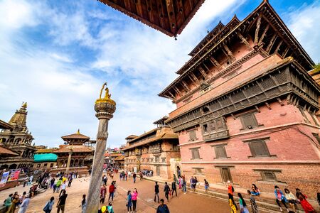Kathmandu, Nepal - September 21 2019: People walking around Patan Durbar Square, a UNESCO Heritage site in Nepal. Temples reconstruction after Earthquake.のeditorial素材