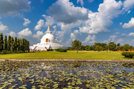 World Peace Stupa in Lumbini, Nepal. World Peace. The non-english text translates to nanmyouhourrnn, a Buddhist Script roughly translating to May Peace Prevail on Earth.のeditorial素材