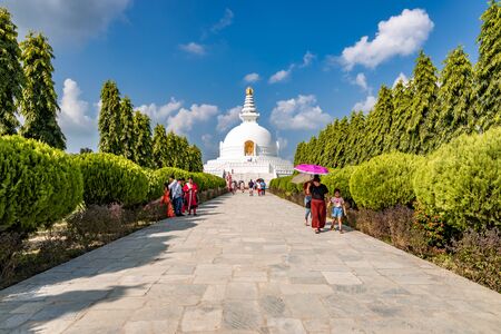 World Peace Stupa in Lumbini, Nepal. World Peace. The non-english text translates to nanmyouhourrnn, a Buddhist Script roughly translating to May Peace Prevail on Earth.のeditorial素材