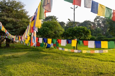 Prayer flags hanging at garden in Lumbini, Nepal