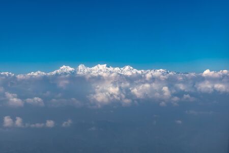Himalaya range seen from the window seat of a planeの写真素材
