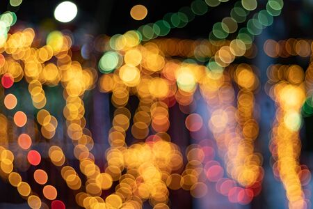 Blue, Green And Yellow, Blurred, Bokeh Lights Against Black Backgroundの写真素材